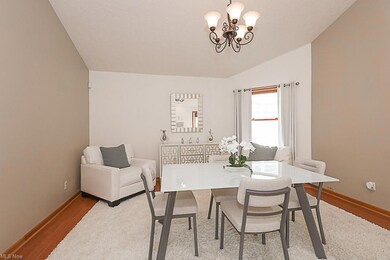 Dining room featuring a notable chandelier &  vaulted ceiling