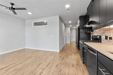 Kitchen featuring appliances with stainless steel
