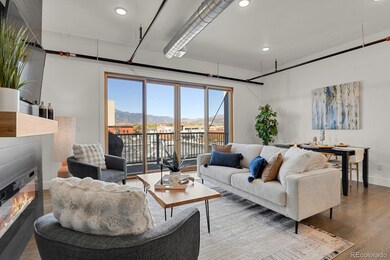 Open floor plan showcases 10’ ceilings, exposed ductwork, and site-finished white oak hardwood flooring throughout