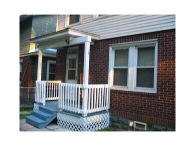 Exterior Back. Newly painted covered rear entry.