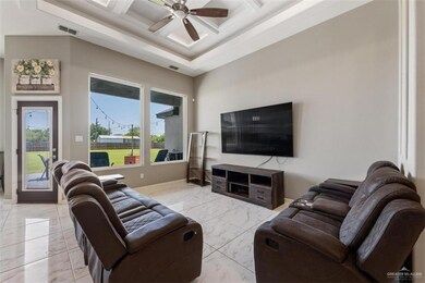 Living area high decarative ceiling, a ceiling fan, tiled marble look finish tiled floor