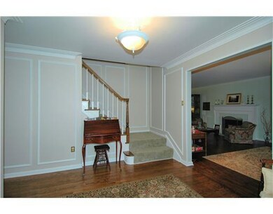 Entry/Foyer. Hardwood flooring in the foyer, crown