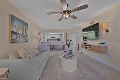 Living room with light hardwood / wood-style floor