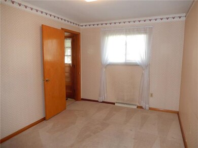 Bedroom or dining room off of the kitchen. Some ha