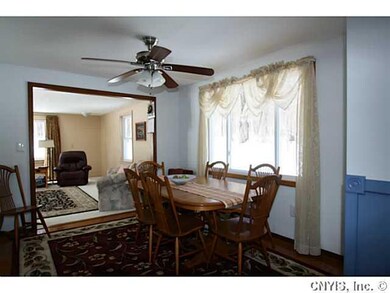 Dining Room. A light & bright dining room has a ne