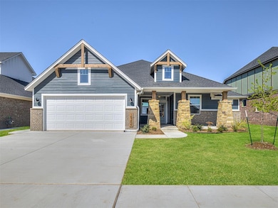 Craftsman inspired home featuring driveway, a front lawn, brick siding, and roof with shingles
