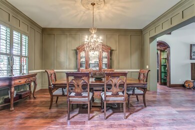 Wow your dinner guests in the  dining room. Detailed Board & Batten walls, heavy crown molding, and a stunning chandelier with ceiling medallion make this a flawless environment for celebrating special occasions. 