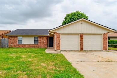 Single story home featuring a garage, brick siding, concrete driveway, and a shingled roof
