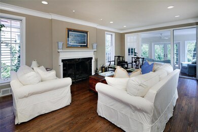 Living room opens to both the dining room and a be
