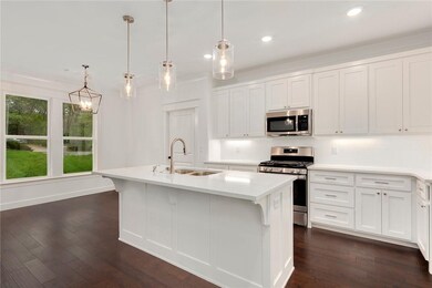 Light fixtures will vary in actual home.  Faucets and cabinet hardware will be black rather than gold.