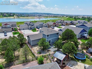 Aerial perspective of suburban area with a large body of water