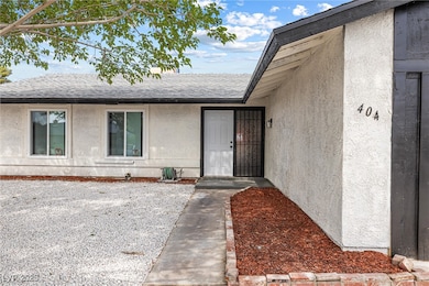 Entrance to property featuring stucco siding and r