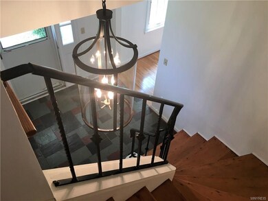 Front Center Entrance into a two story foyer with 