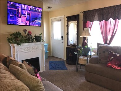 Newer insulated front door with combination front door lock.  Electric fireplace and mounted television is to remain with the home.