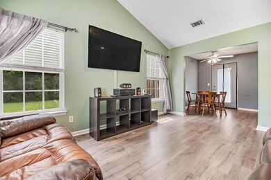 The living area is bathed in natural light and ove