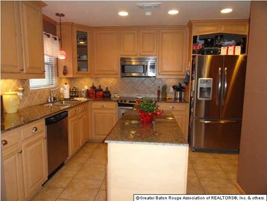 New kitchen with slab granite , stainless applianc