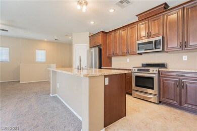 Island kitchen with granite counters, stainless st