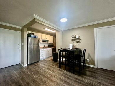 Dining room with hardwood / wood-style flooring, c