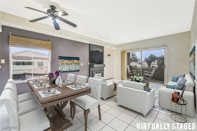 Virtually Staged. Living area with ceiling fan and