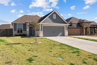 View of front of property with a garage and a fron