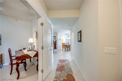 Hallway with light tile patterned flooring