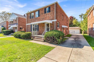 View of front facade featuring a front lawn and a 
