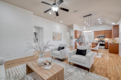 Living area with recessed lighting, light wood-st