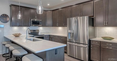 Kitchen with decorative backsplash, light countert