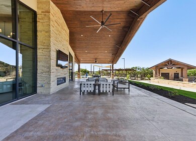 View of patio featuring a ceiling fan