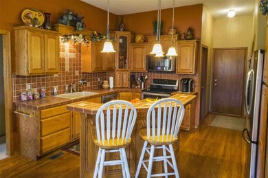 All stainless steel appliances stay. Hall leads to