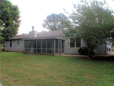 Rear of home has large screened porch.