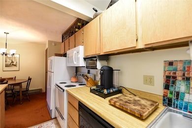Kitchen with pendant lighting, an inviting chandel
