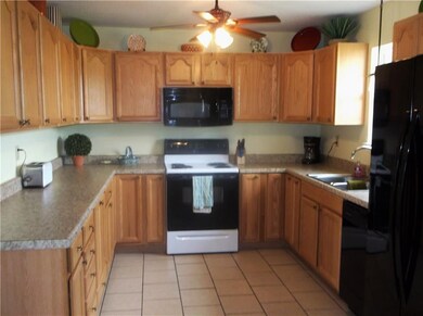 SPACIOUS KITCHEN WITH PLENTY OF CABINET STORAGE.