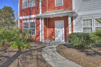 Doorway to property with roof with shingles