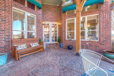 Front door is off of the covered patio. This patio