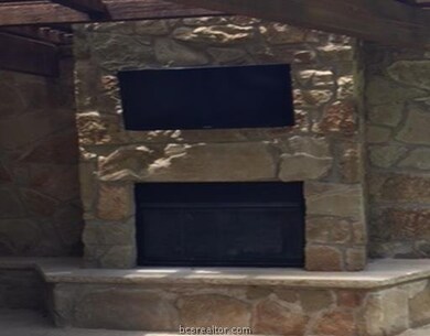 Other. Back fireplace with TV