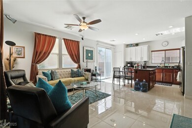 Living area with ceiling fan, and recessed lightin