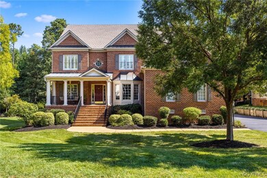 View of front of house with a porch and a front la