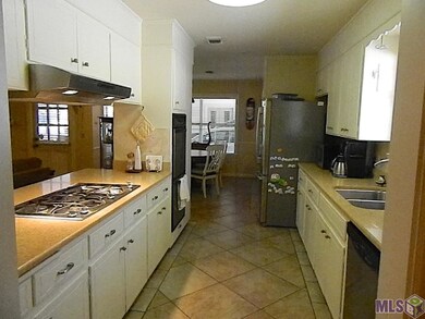 Open to den, breakfast, and formal dining.