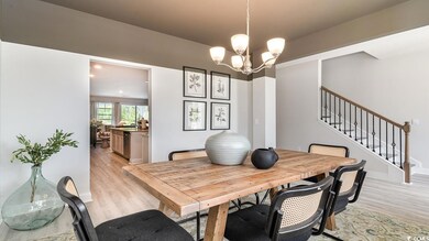Dining area with an inviting chandelier and light 