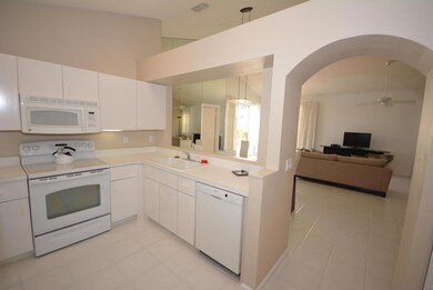 Kitchen with entry into living area