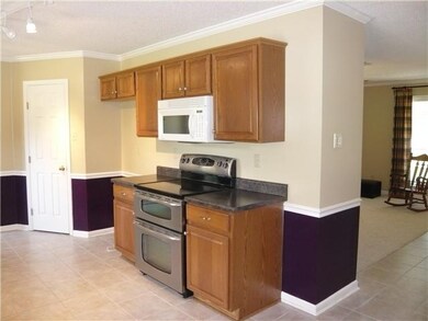Stainless oven has double ovens.