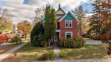 Front door with small deck above.