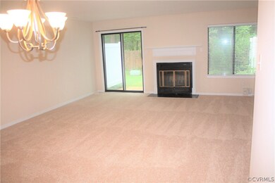 View of Great Room from Foyer. Wood burning firepl