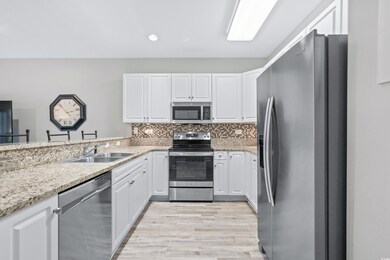 Kitchen featuring sink, light hardwood / wood-styl