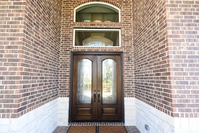 Double doors & soaring ceiling on porch