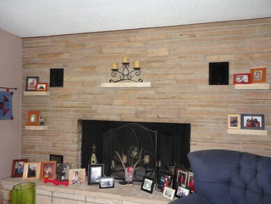 Full wall of stone wood burning fireplace