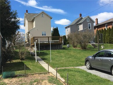 Rear view of home and yard.