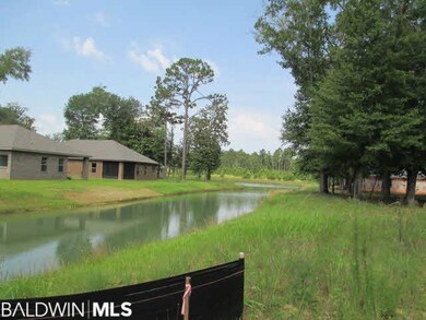 Canal from well water, stocked w/fish.