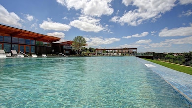 Community pool featuring a patio area